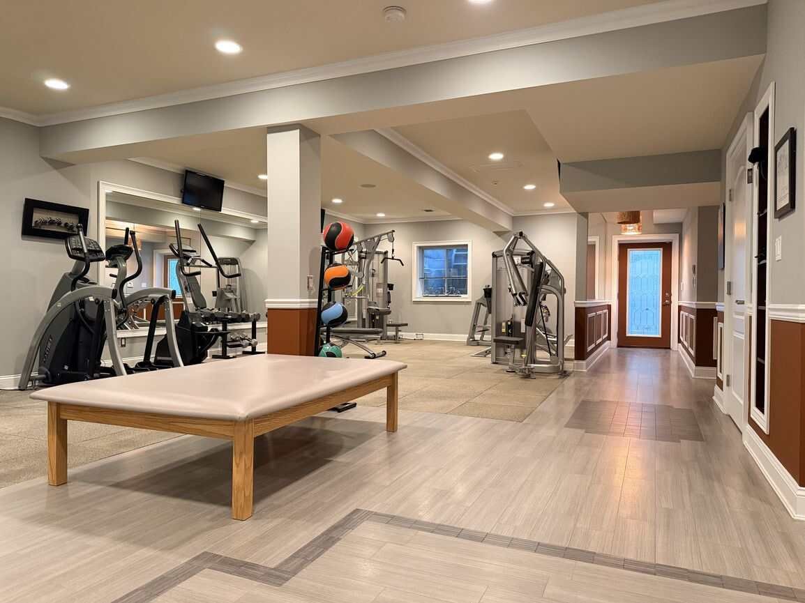 Lower-level recreation area with seating and table
