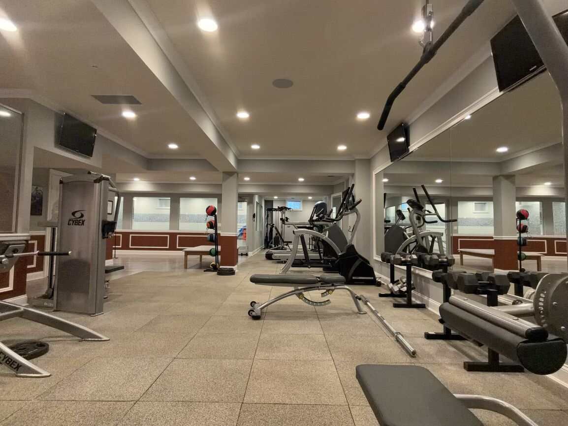Lower-level fitness room set up as a home gym