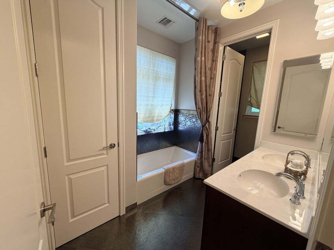 En-suite bathroom serving the second-floor secondary bedroom
