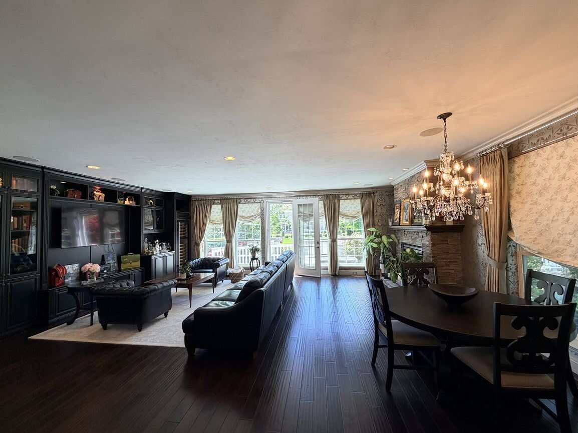 Kitchen seating area beside the granite counter with hardwood floors