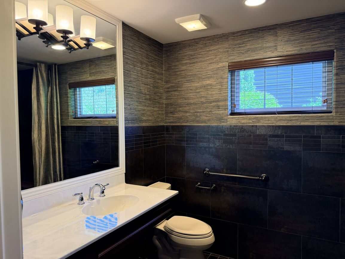 Bathroom serving the main-level office or first-floor bedroom